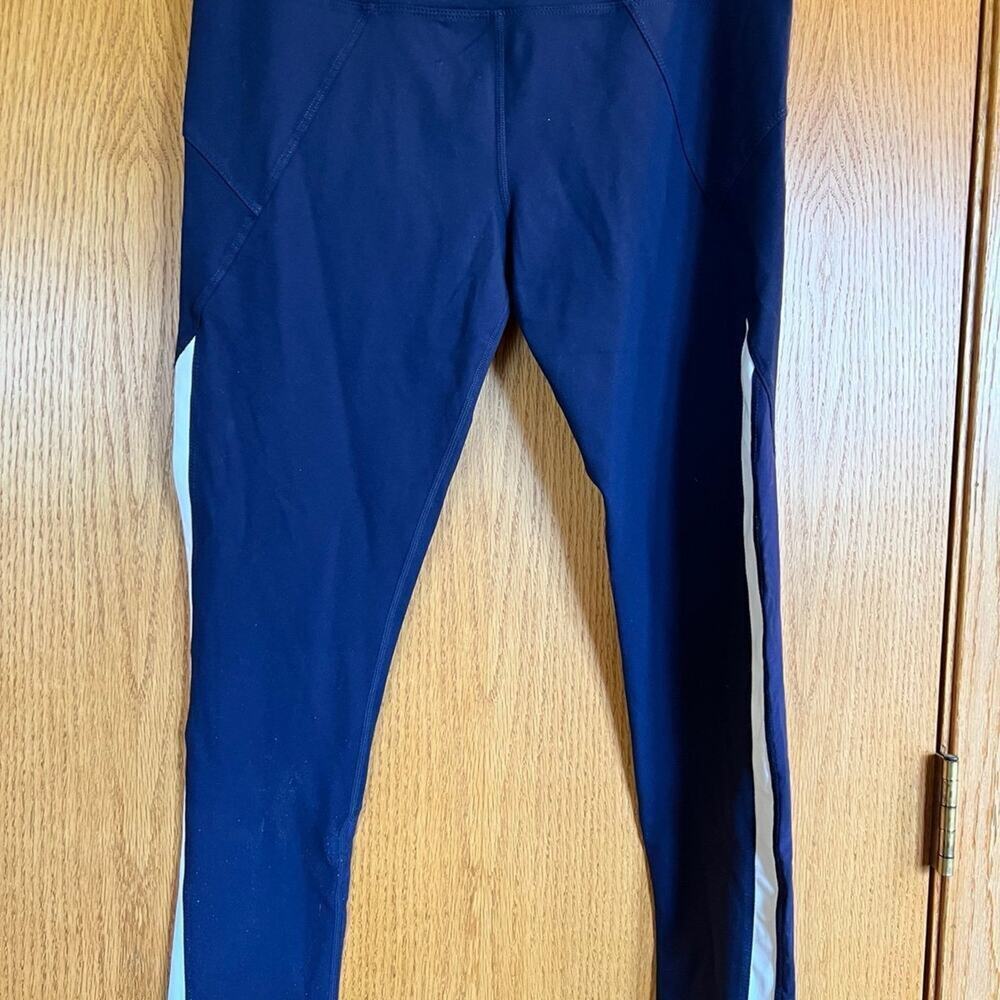 Fornia leggings, navy color white stripe on side of legs, women’s size L